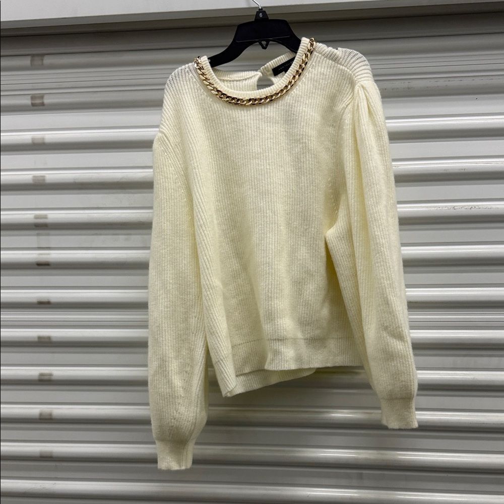 Elegant Cream Sweater with Gold Chain Detail